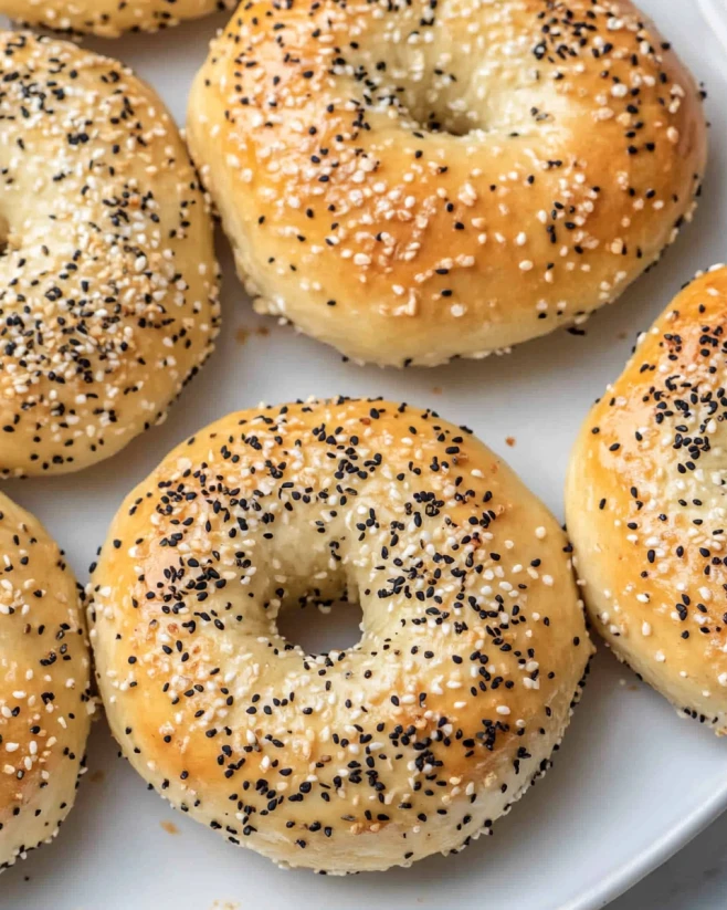 cottage-cheese-bagels-everything-seasoning Homemade cottage cheese bagels with everything seasoning on a white plate