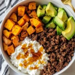 The Shocking Beef Sweet Potato Cottage Cheese Bowl Mistake 99% Of People Make (And How To Fix It) 2 Beef sweet potato cottage cheese bowl with avocado, roasted sweet potatoes, and taco-seasoned ground beef in a white bowl